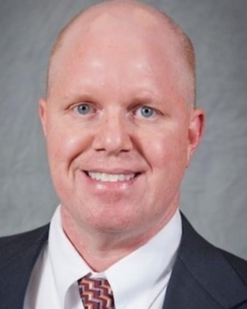 Mr. Brett Holland