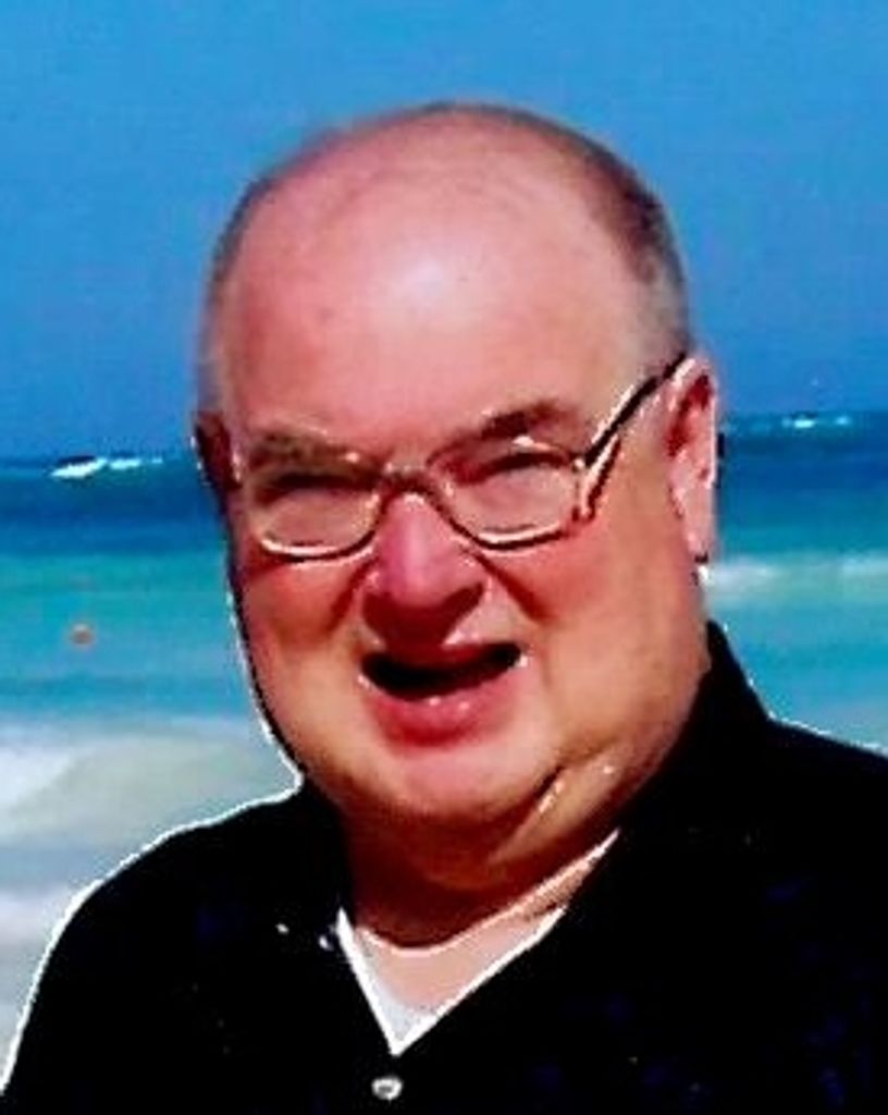 James E. “Skip” Mills