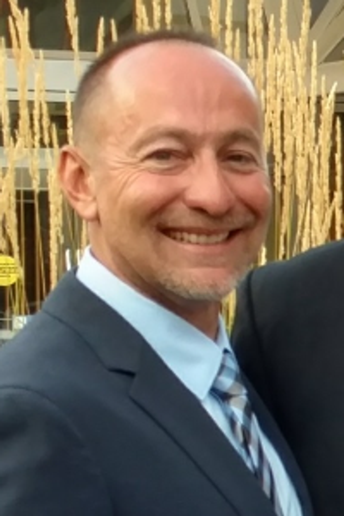 John M. "Jamike" Carlucci