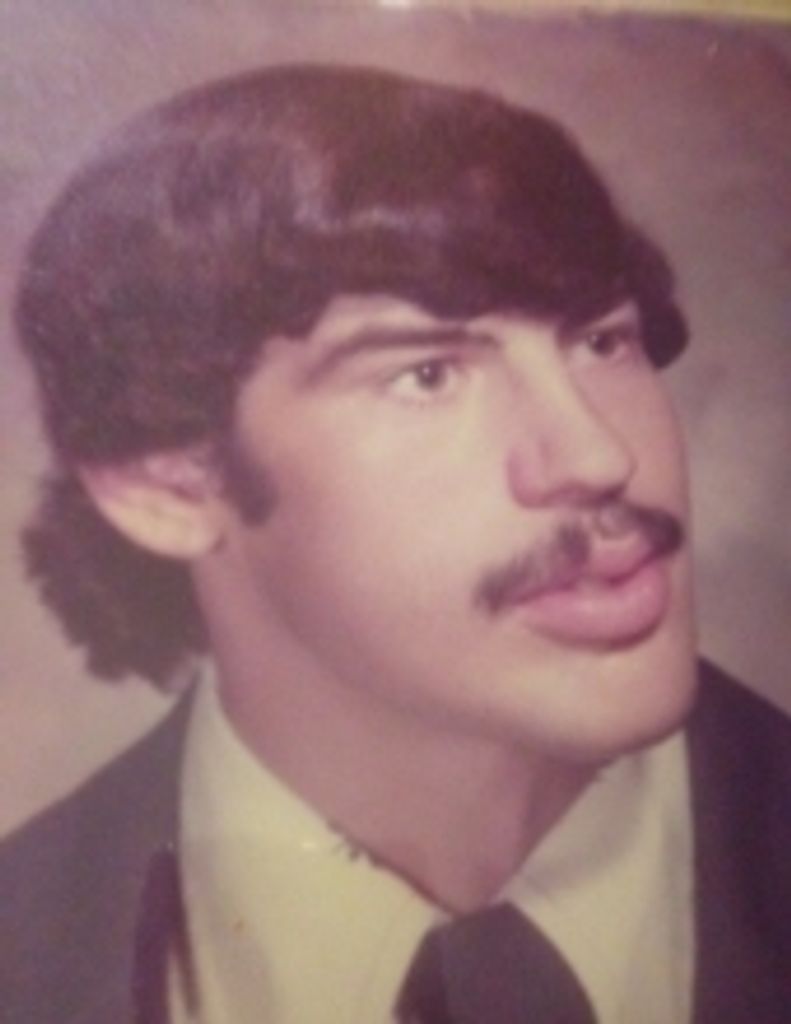 Mark  E. Rhule