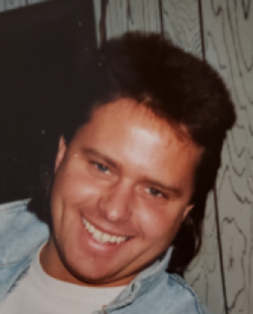 John  "Mugsy" Deluca