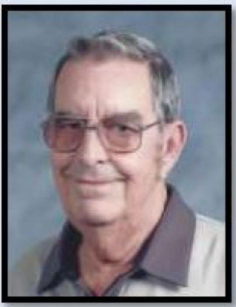 Charles “Chuck” E. Six