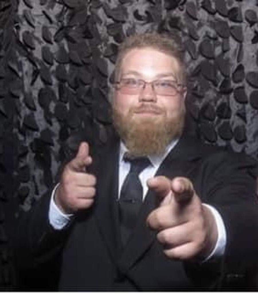 Adam K. Thompson