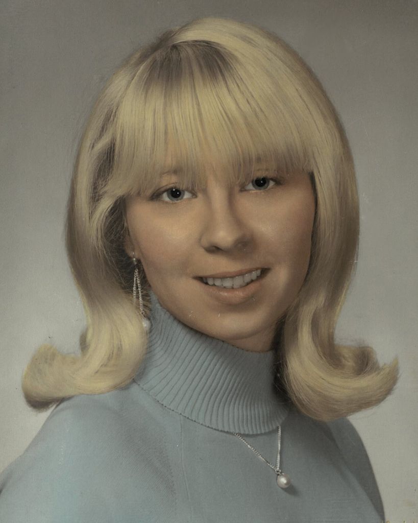 Magel "Midge" L. DeBlois