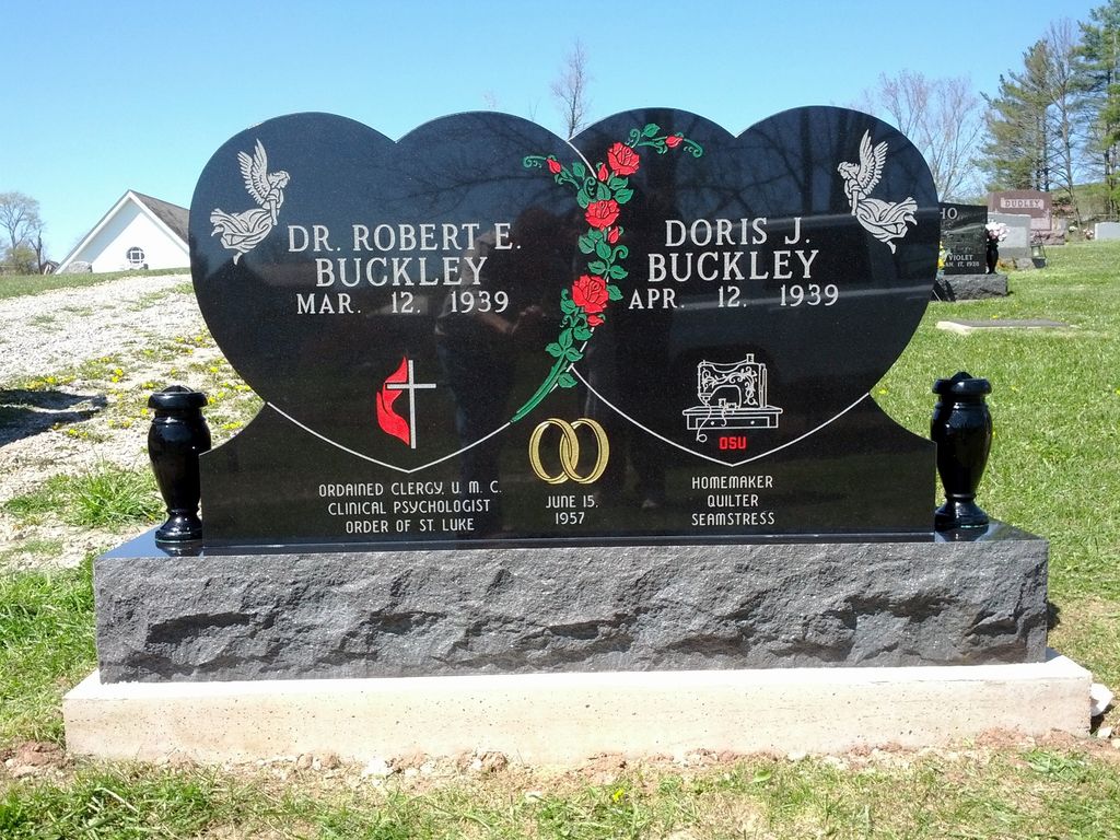 Double-heart monument with roses, angels, and two vases