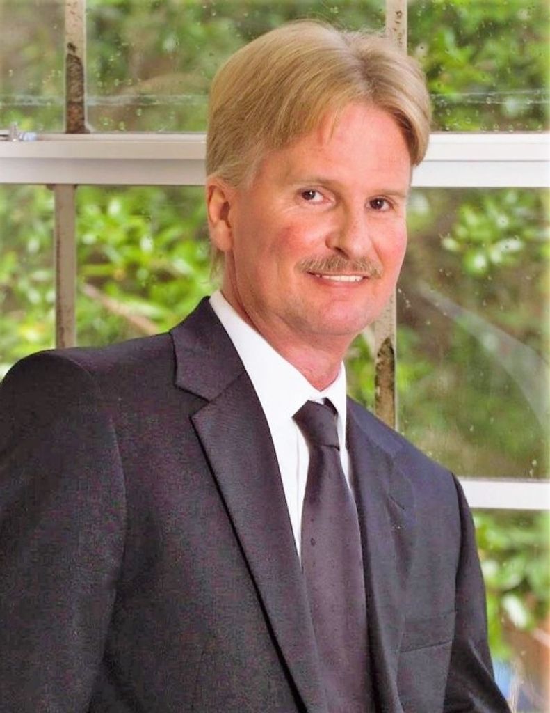 John P. Huskins