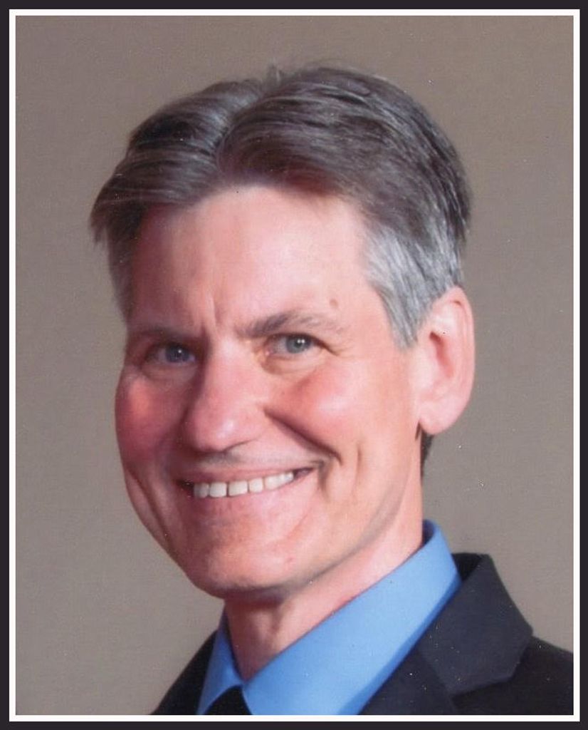 Mark E. Holland