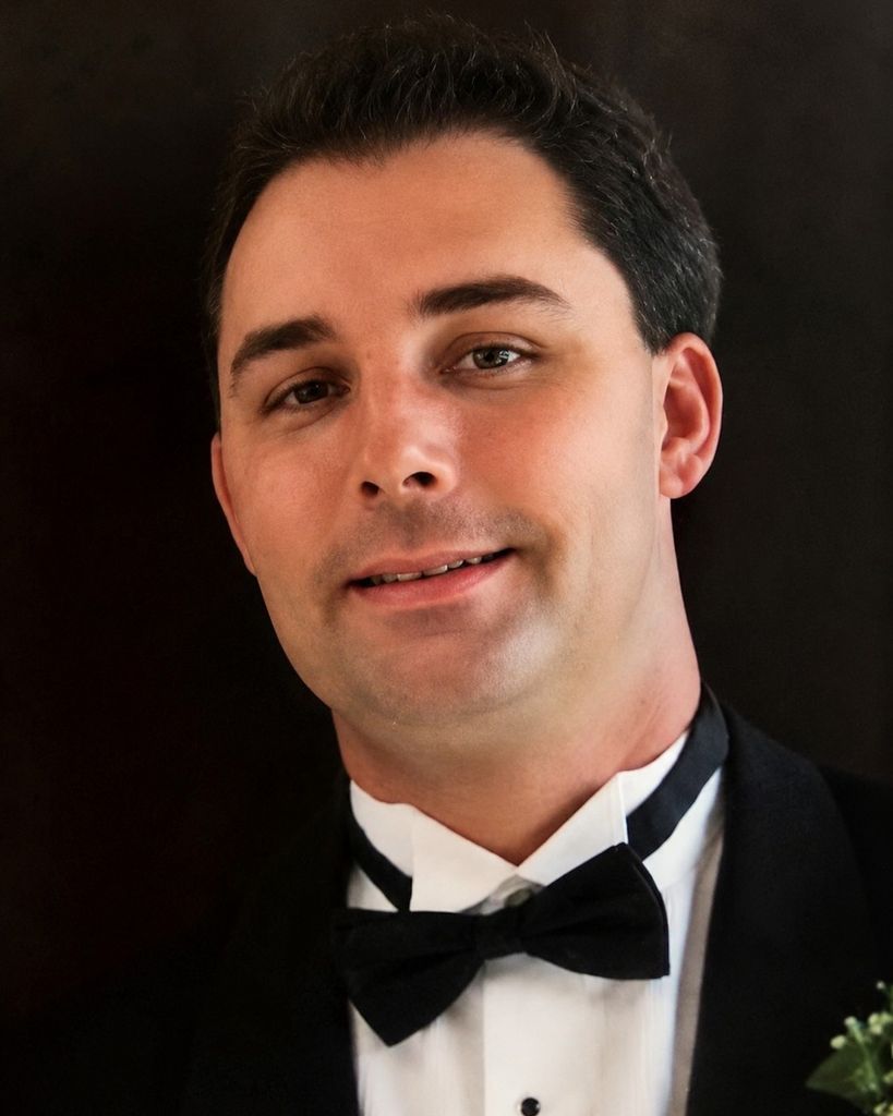 JOHN J. SHIELS