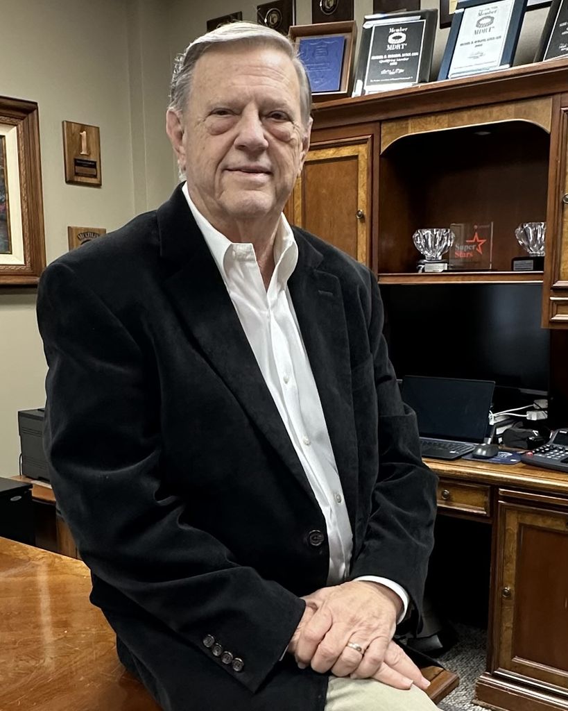Michael H. "Mike" Burgess