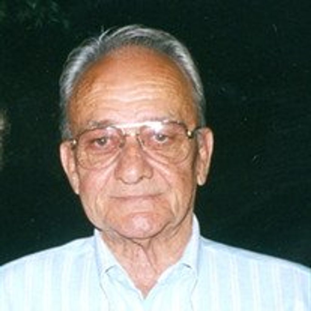 Clarence  E. Sholders