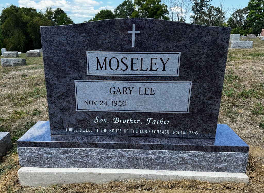 Bahama Blue upright monument with a cross and contrasting inscription panels