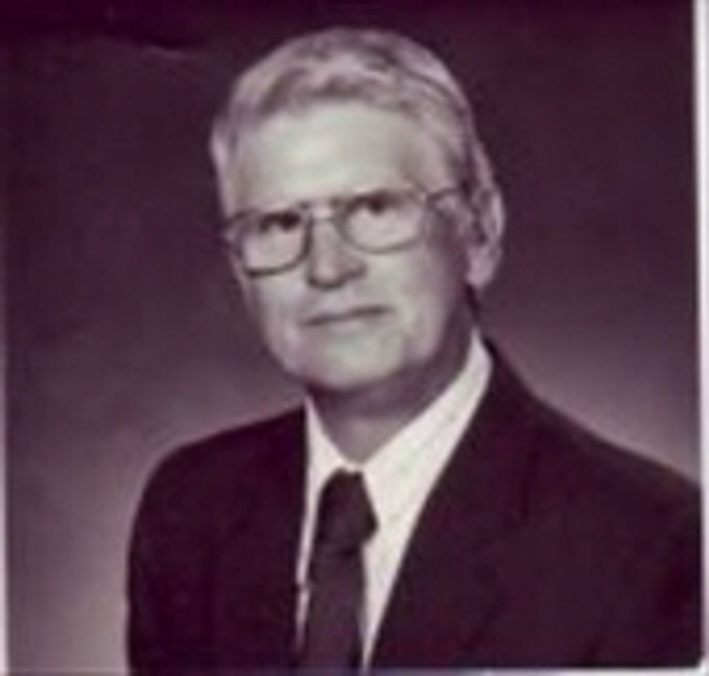 Mark E. White