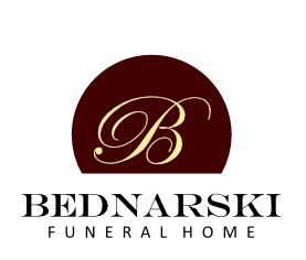 Bednarski Funeral Home logo with gold script B on a maroon circle over black text