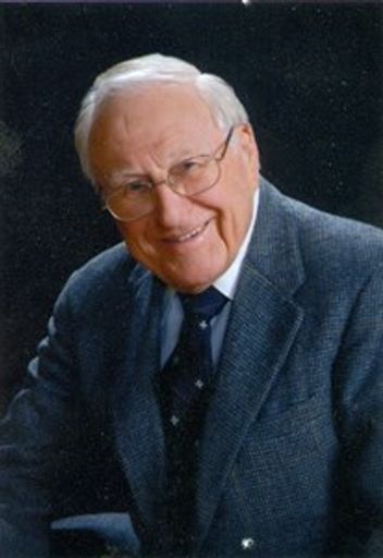 James E. Madigan