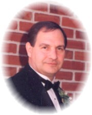 DENNIS E. DISTEL