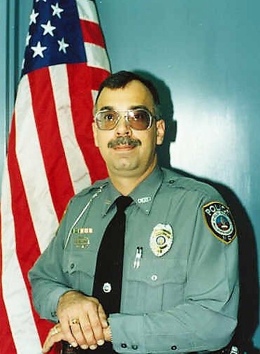 Officer Neal E. Holloway (Ret.)