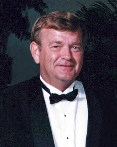 Thomas E. "Tom" Holcomb